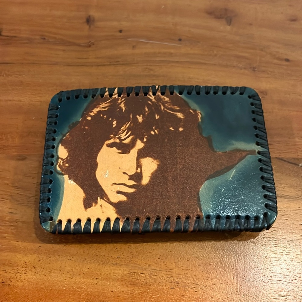 Jim Morrison Painted on leather hand stitched belt buckle measures 4.5 by 3.25”